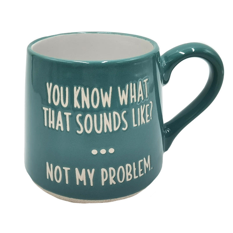Teal coffee mug from Koppers with 'you know what that sounds like?... not my problem' on it, on a white background