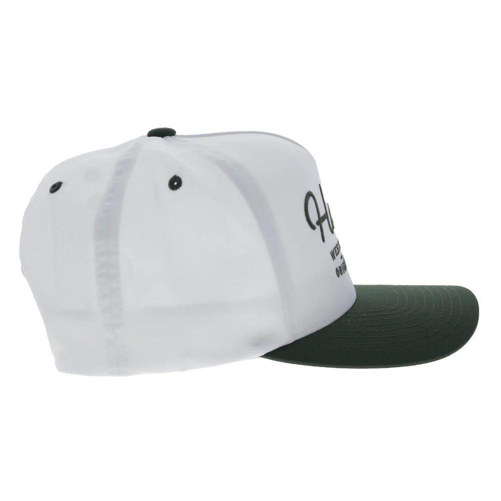 a white and green cap by hooey on a white background