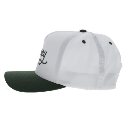 a white and green cap by hooey on a white background