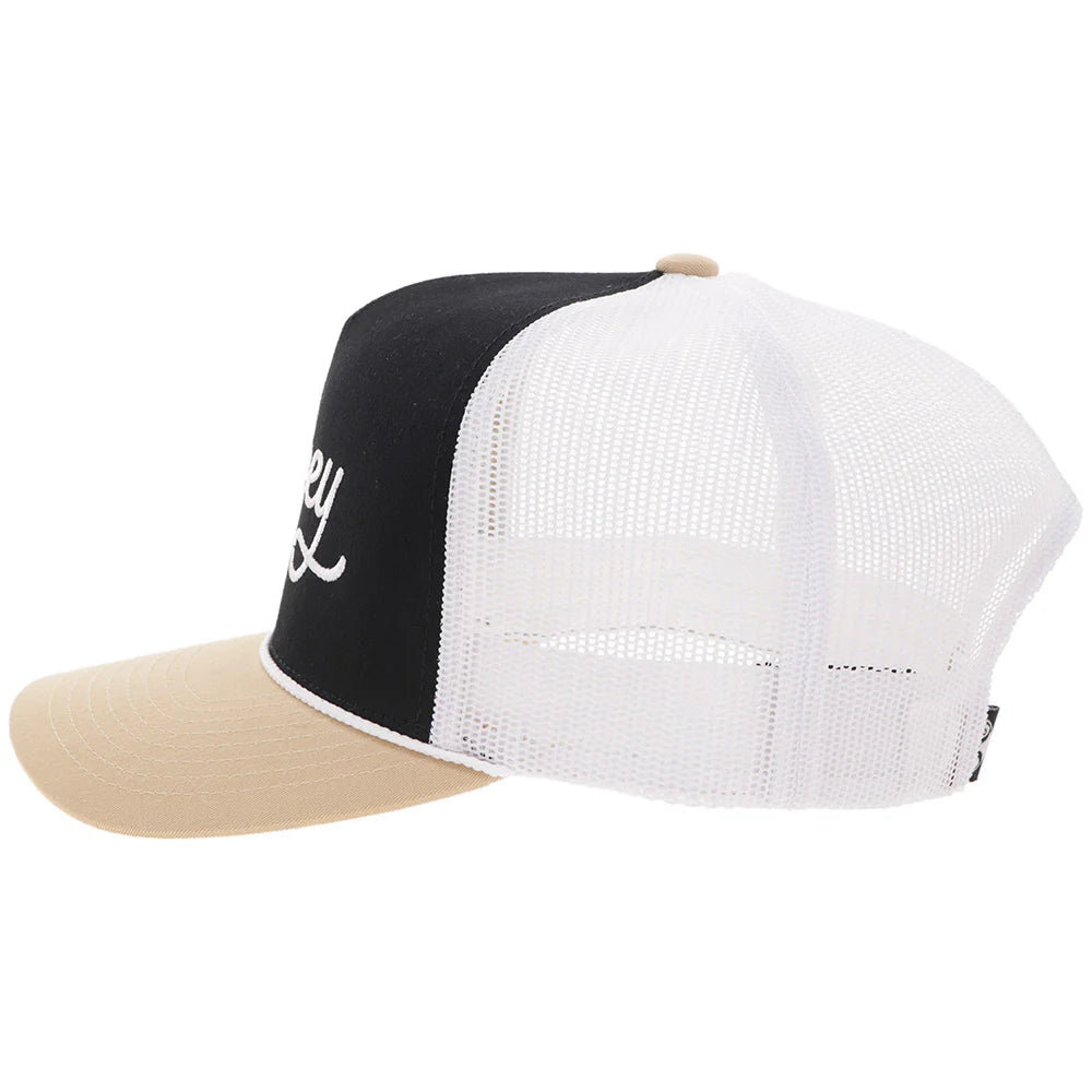 a black, tan and white cap by hooey on a white background