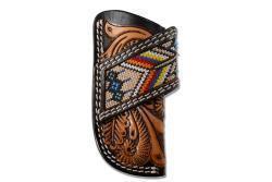 a leather vertical knife sheath with tooling and embroidery detail
