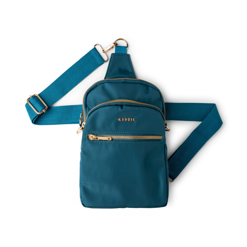 Teal Kedzie crossbody bag with gold zipper on a white background