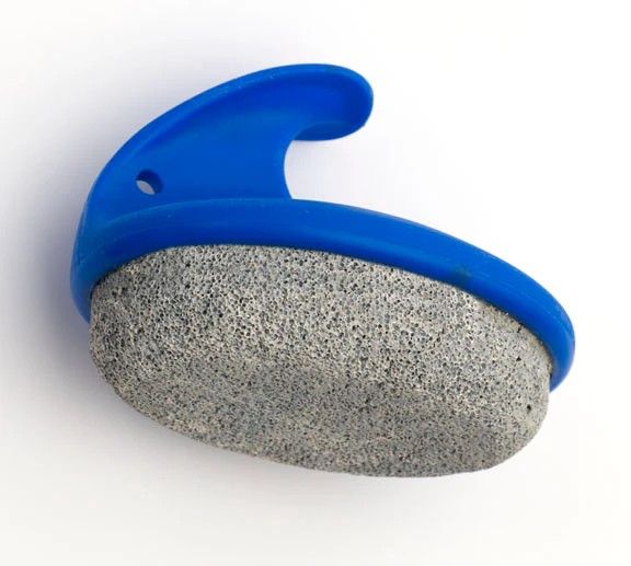 Gray pumice stone scrubber with blue handle on a white background