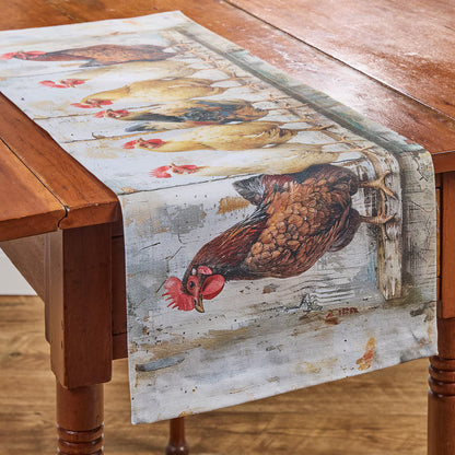 Table runner with rooster design on a wooden table