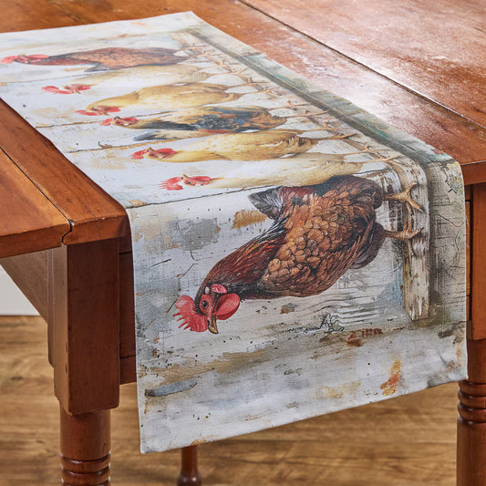 Table runner with rooster design on a wooden table