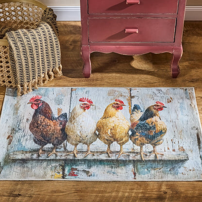 Decorative rug with chicken design on a wooden floor next to a red dresser.