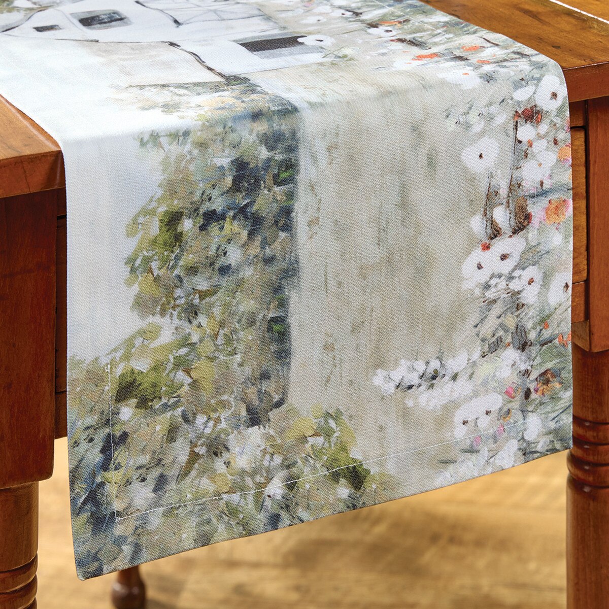 Table runner with nature-themed design on a wooden table