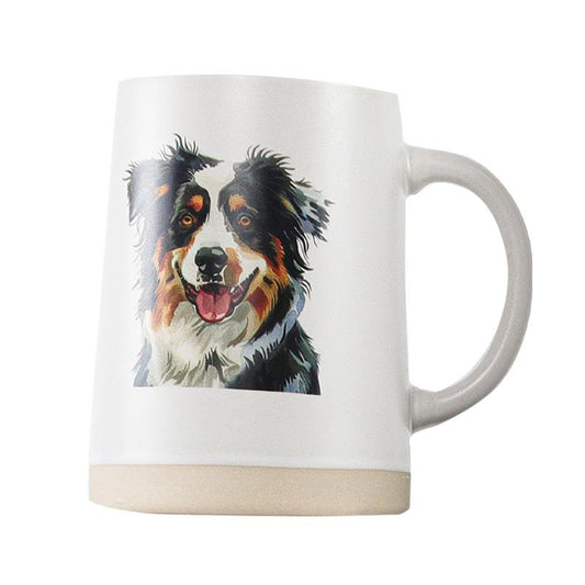 white coffee mug from Koppers with an australian shepherd on it, on a white background