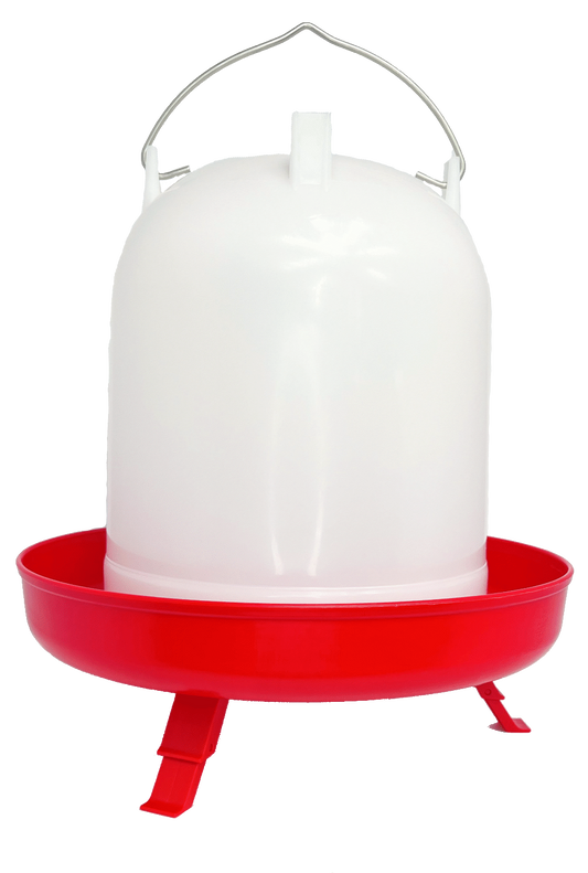 Red plastic chicken feeder with a white container on a white background