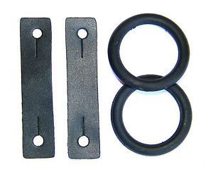A set of four black rubber and plastic replacement parts, including two flat rectangular pieces with circular holes and two circular O-rings, shown on a plain white background.