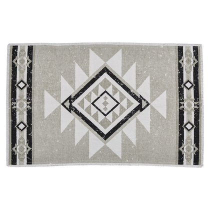 Gray rug with geometric black and white pattern on a white background