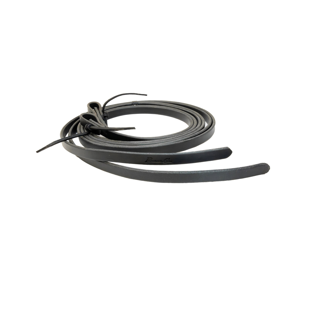 coiled black leather reins used for horses on a white background