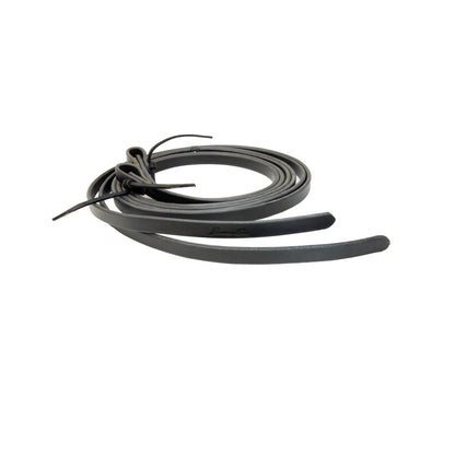 coiled black leather reins used for horses on a white background