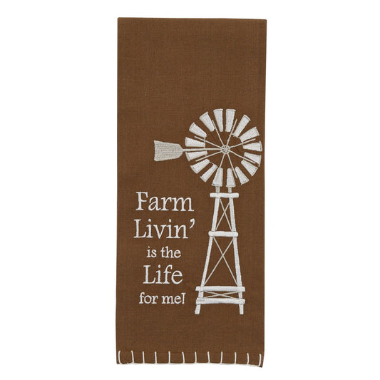 Brown towel with white windmill design and text on a white background
