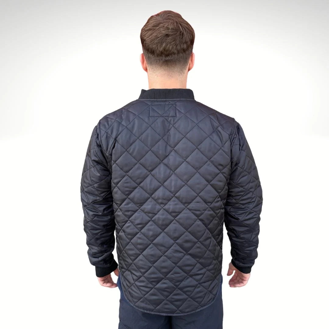 Man wearing a quilted jacket from behind on a white background