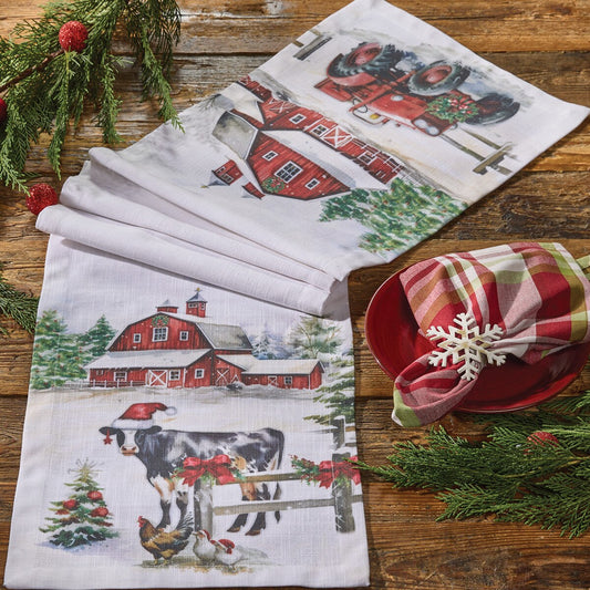 Christmas themed table runner from Park Designs with a farm scene including some animals, a barn and a tractor