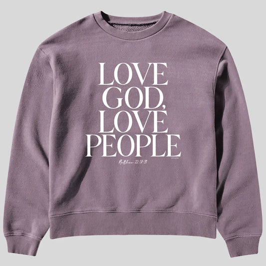 A dusty purple crewneck sweatshirt from Kerusso featuring the text 'LOVE GOD, LOVE PEOPLE' in large white serif letters on the front, with a small Bible verse printed below.