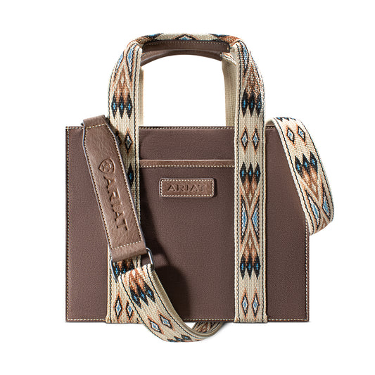 a square brown canvas bag with southwest detail on the straps and handle with 'Ariat' patch