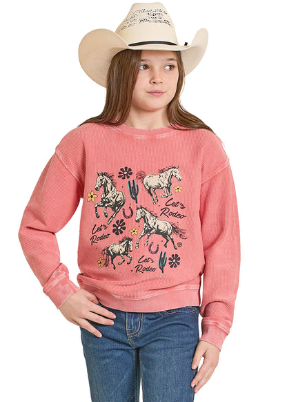 Girl wearing a pink sweatshirt with horse graphics and a cowboy hat on a white background
