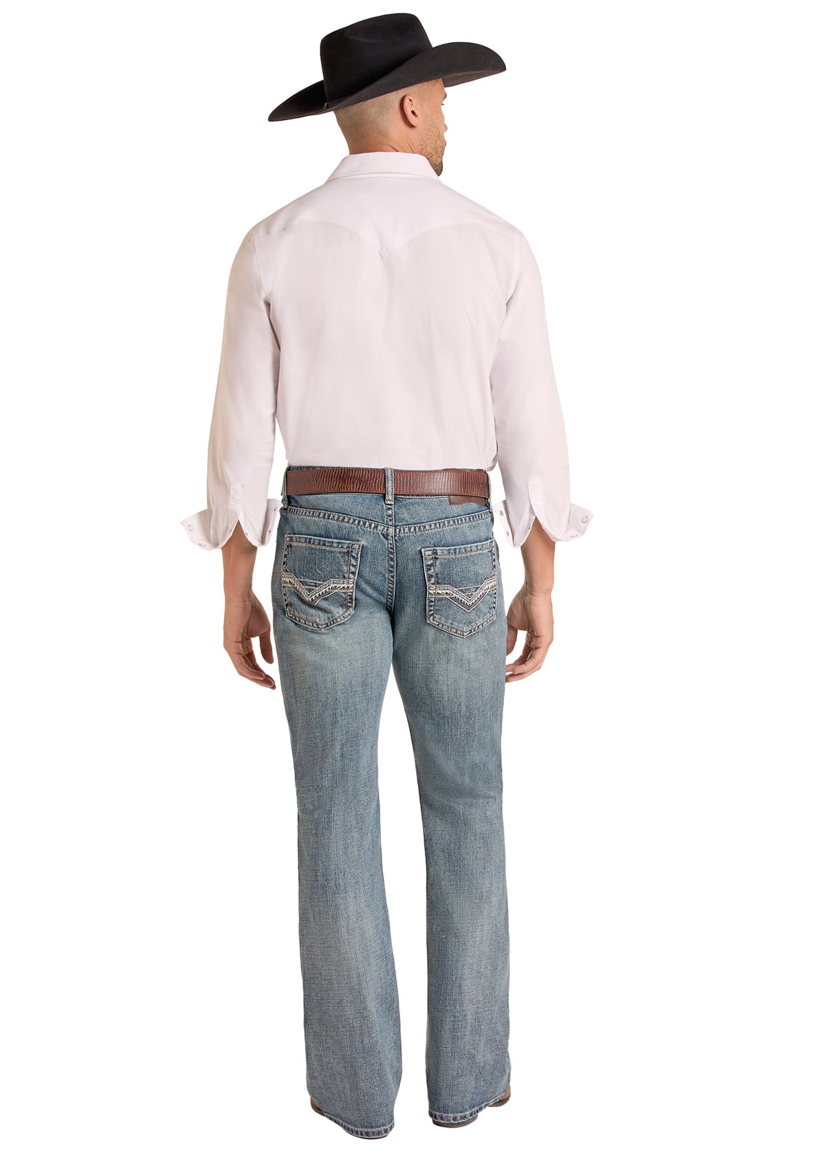 A man shown from the back wearing a light pink western-style shirt, blue Rock & Roll Denim  jeans, a brown belt, and a black cowboy hat, against a plain white background.