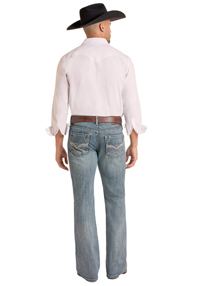 A man shown from the back wearing a light pink western-style shirt, blue Rock & Roll Denim  jeans, a brown belt, and a black cowboy hat, against a plain white background.