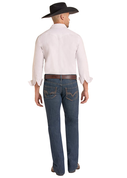 Rear view of a man wearing a white long-sleeve button-down shirt, dark blue jeans, a brown belt, and a black cowboy hat against a white background.