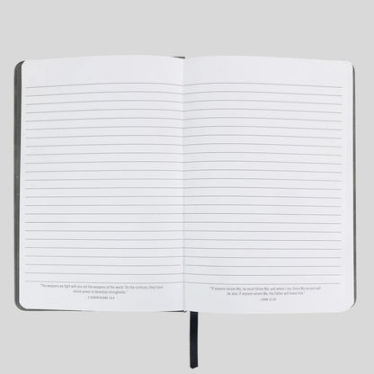 An open lined journal or notebook from Kerusso with black text quotes printed at the bottom of both pages, shown against a light gray background.