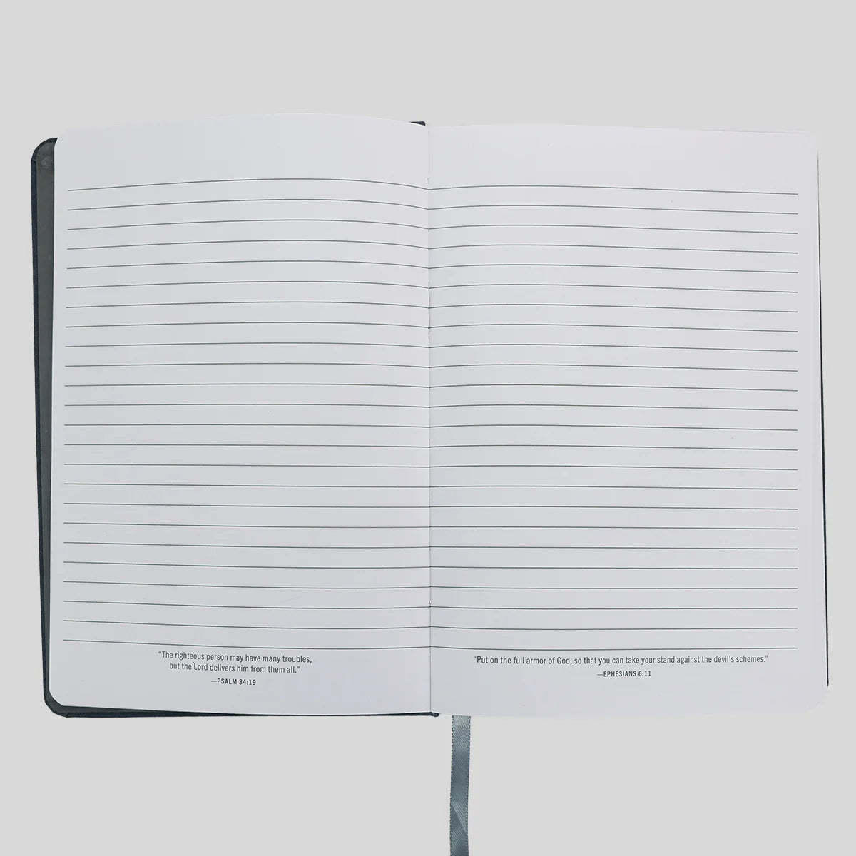 An open lined journal or notebook from Kerusso with black text at the bottom of each page, photographed against a light gray background.
