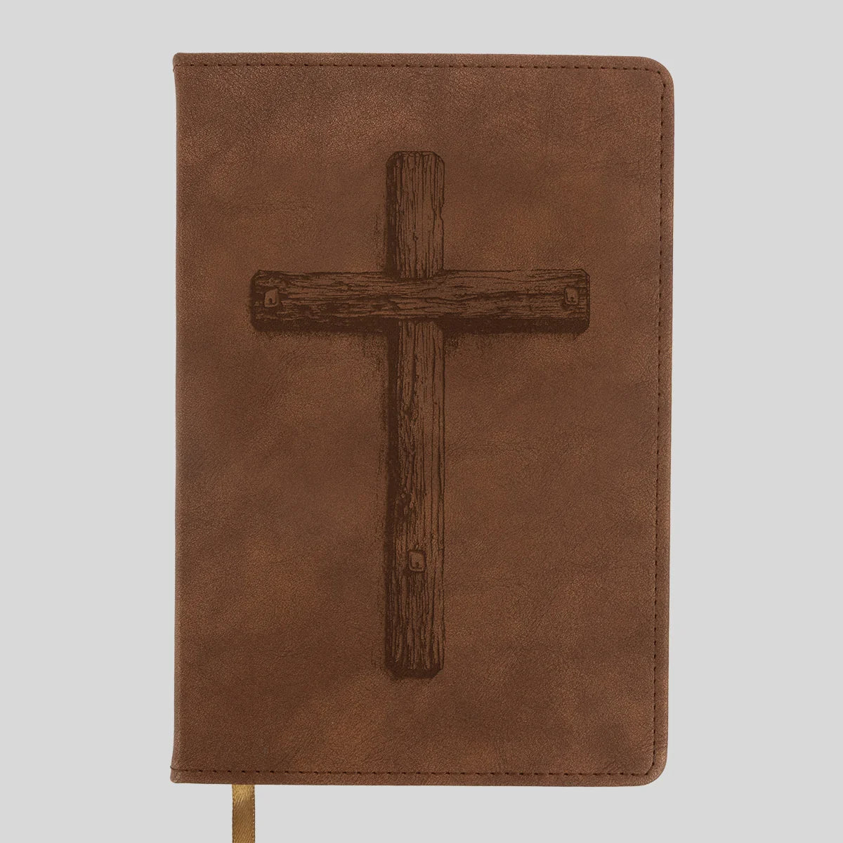 A brown faux-leather Bible or book cover from Kerusso featuring a dark brown embossed wooden cross on the front, shown against a light gray background.