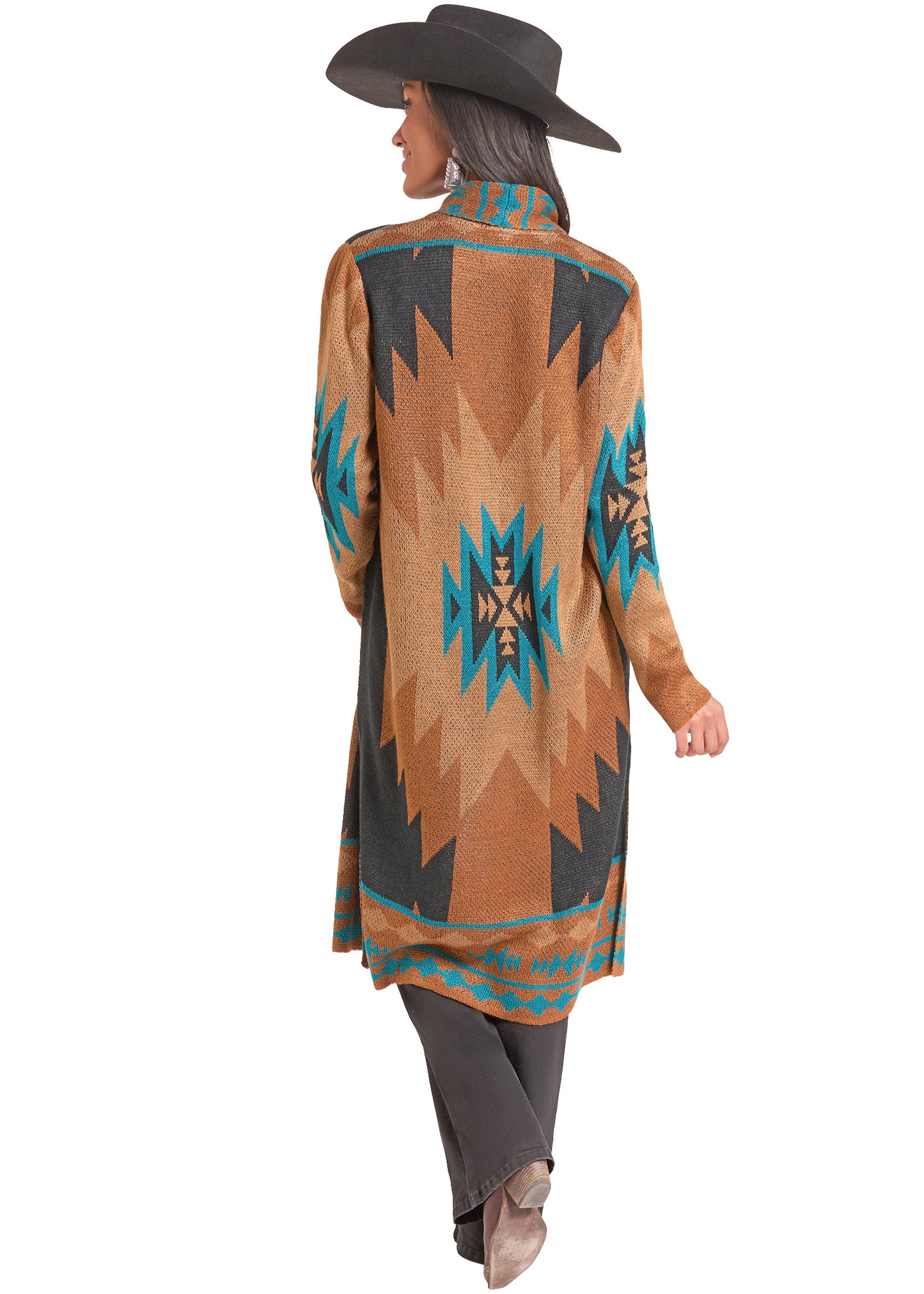A woman shown from the back wearing a long-sleeve, high-neck patterned Rock&Roll Cowgirl cardigan thats tan, black, and turquoise, along with dark pants and a black wide-brim hat, against a plain white background.