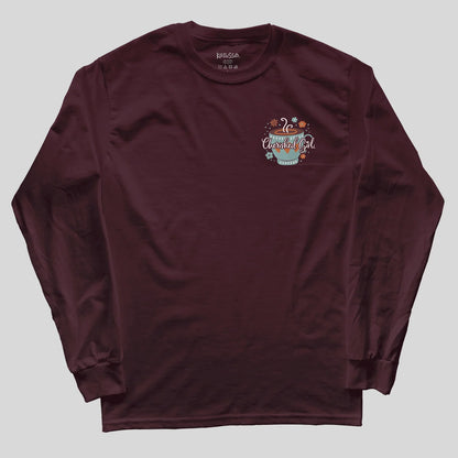 A maroon long-sleeve t-shirt with a small graphic on the left chest featuring a teal mug and the text 'Cherished Girl' surrounded by small illustrations, laid flat on a light gray background.