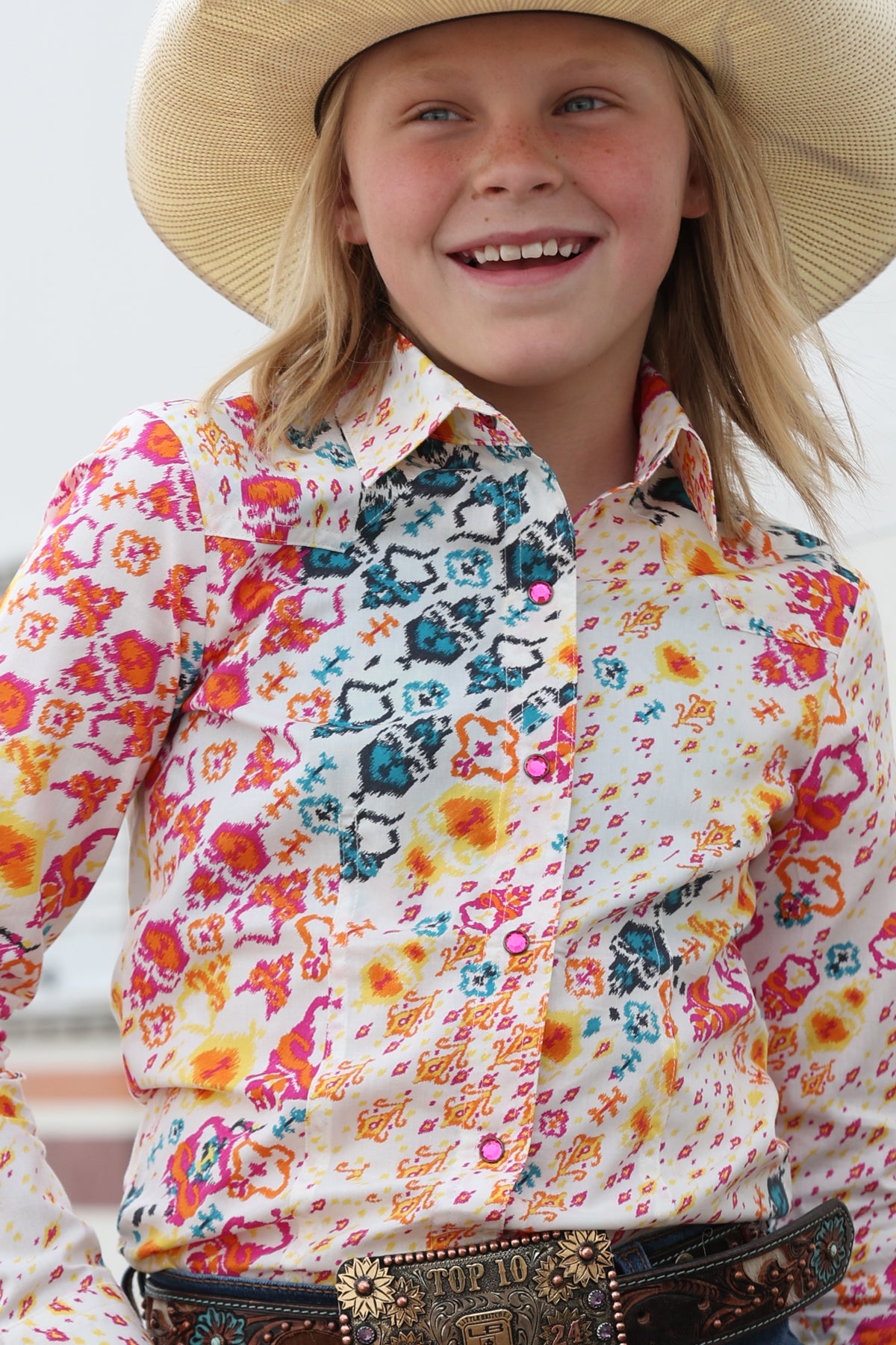 girl wearing a patterned Cinch shirt 