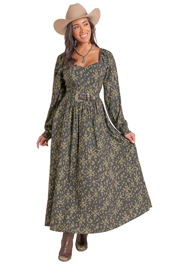 Woman wearing a green and black long dress by Panhandle Slim and a brown cowboy hat on a white background