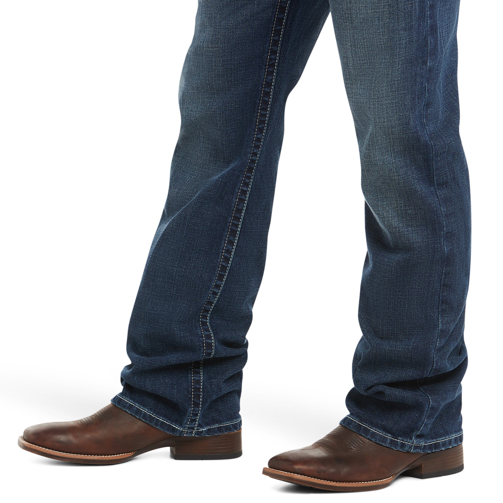 denim Ariat jeans with brown boots on a white background