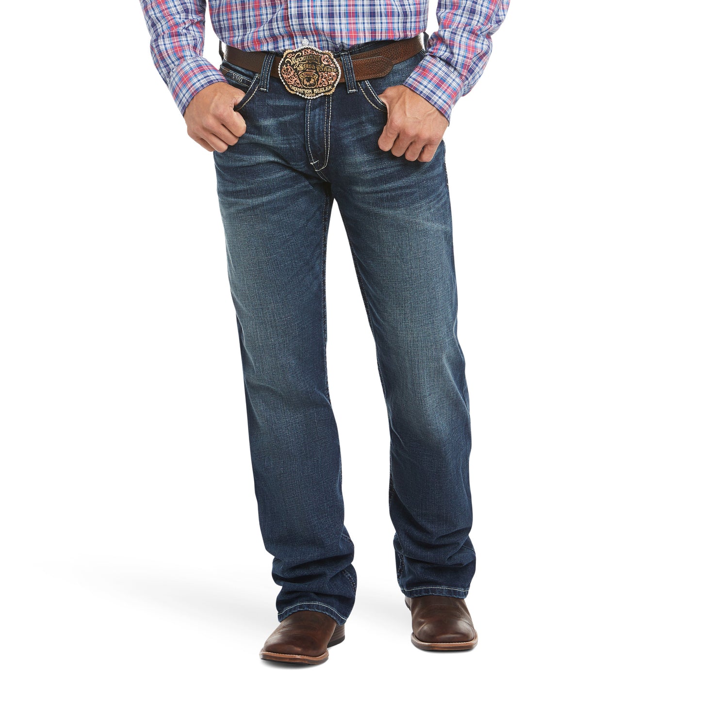A man wearing a low-rise, turnout men's Ariat jean with a fashion boot cut, relaxed fit through the waist, hip, and thigh, with a visible belt and buckle.