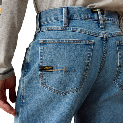 man wearing denim Ariat jeans on a white background