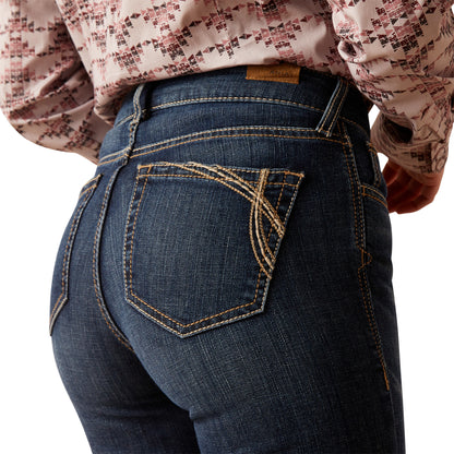 Close-up of blue jeans with a decorative back pocket on a white background