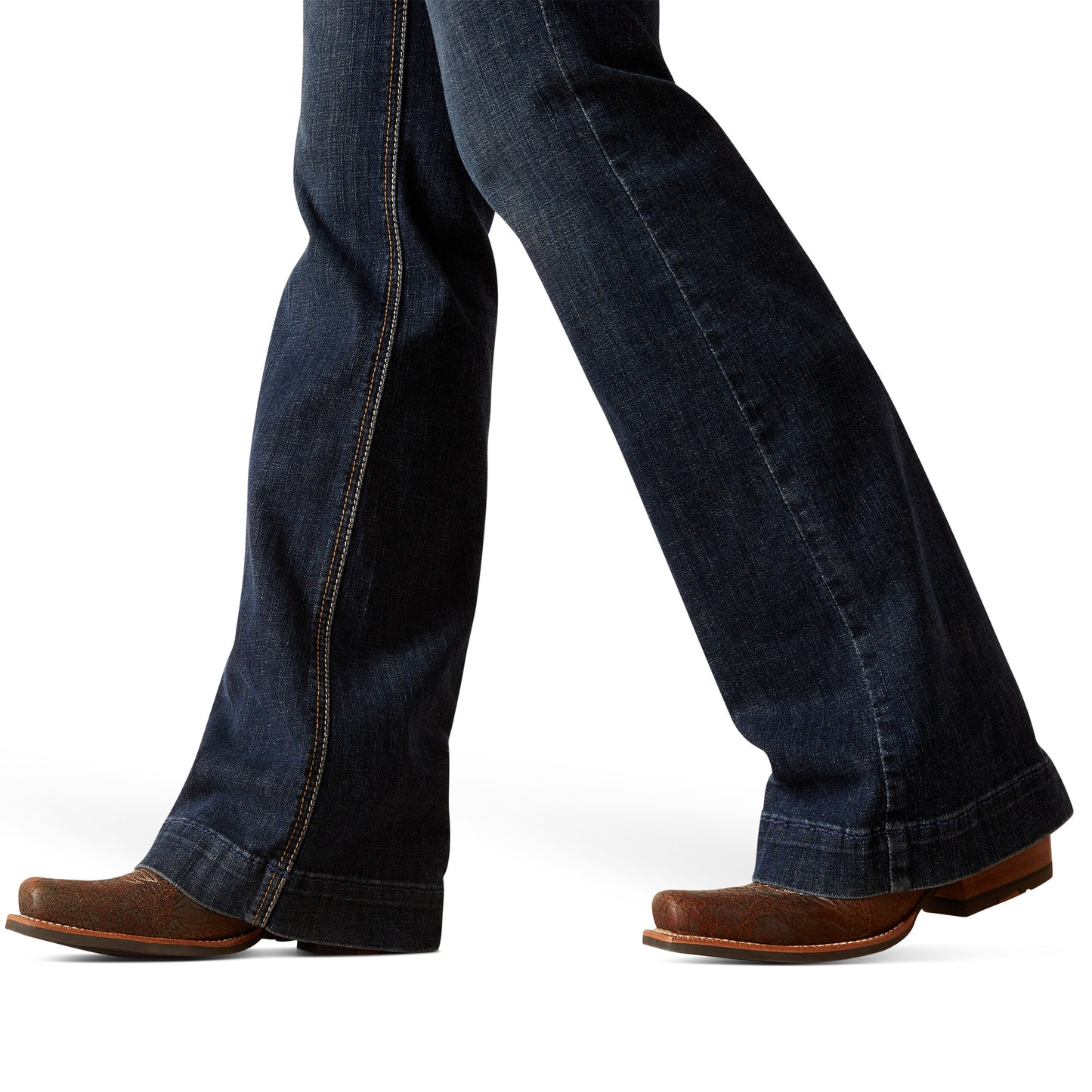 Dark blue jeans worn by a person on a white background