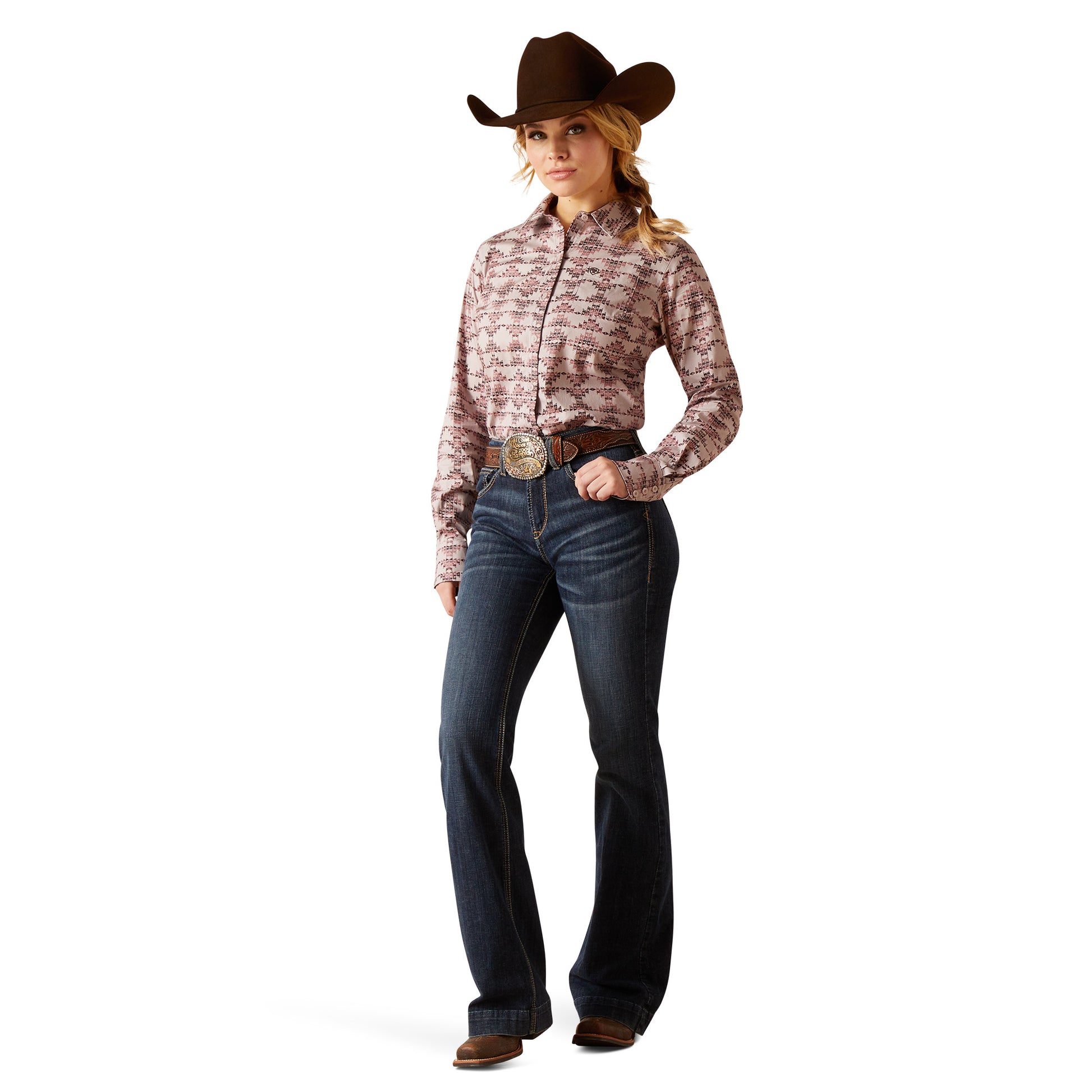 Woman wearing a patterned shirt, jeans, and a cowboy hat on a white background