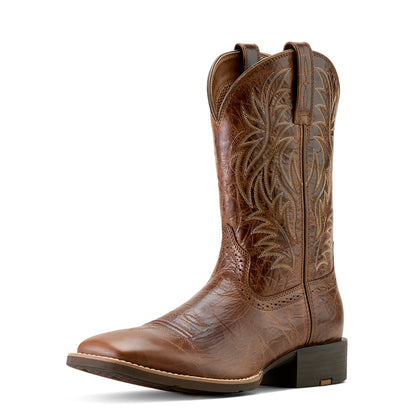 Brown cowboy boot with intricate embossing on a white background
