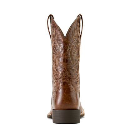 Brown cowboy boot with intricate design on a white background