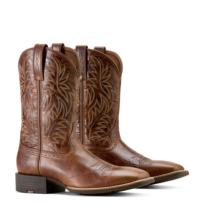 Pair of brown 'Ariat' cowboy boots with intricate designs on a white background