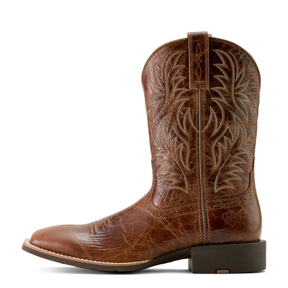 Brown 'Ariat' cowboy boot with intricate embossing on a white background