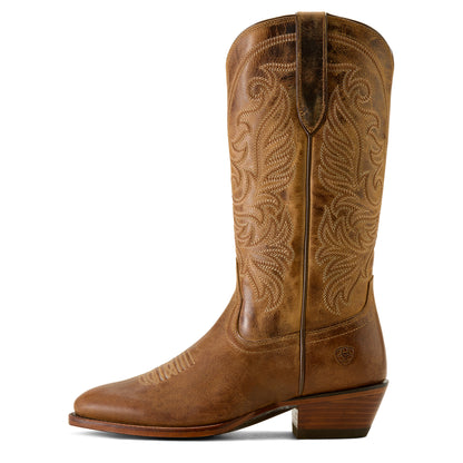 Brown cowboy boot with intricate stitching on a white background