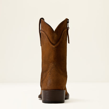 A single brown suede cowboy boot shown from the back, featuring a side zipper and a stacked dark brown heel, set against a plain off-white background.