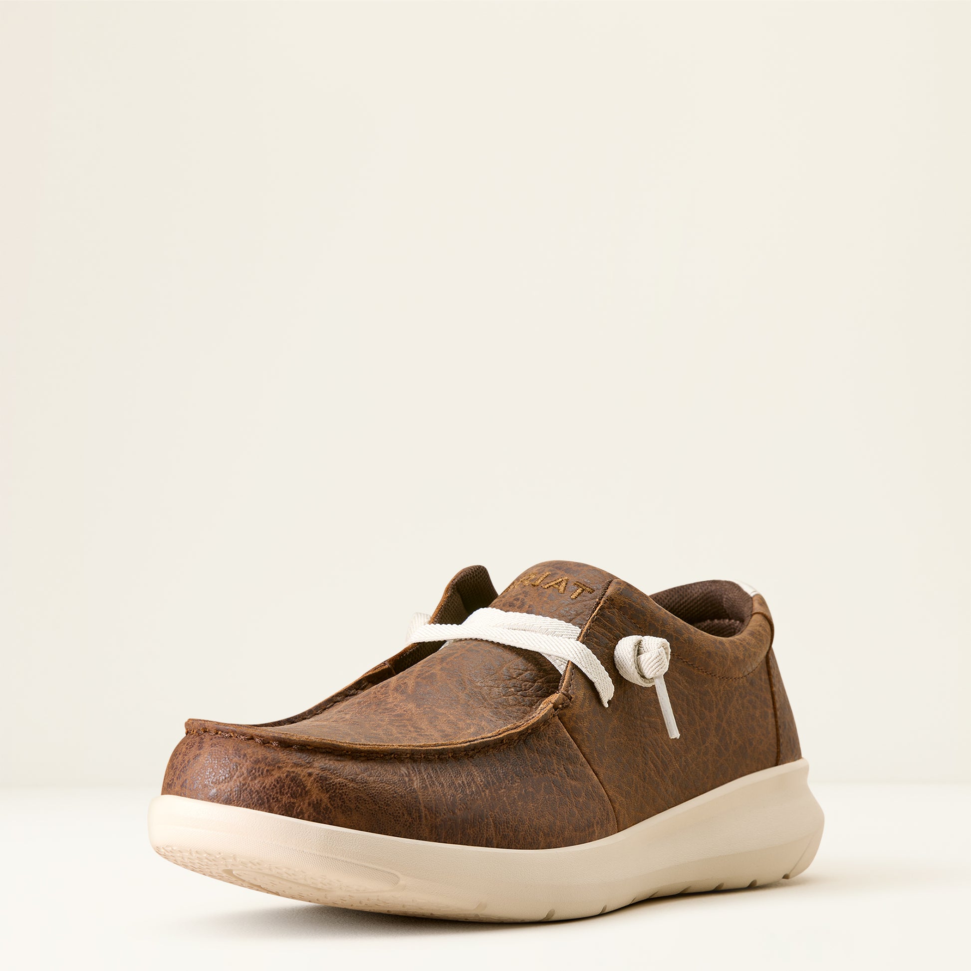 a men's brown elephant print hilo shoe by ariat on an off white background