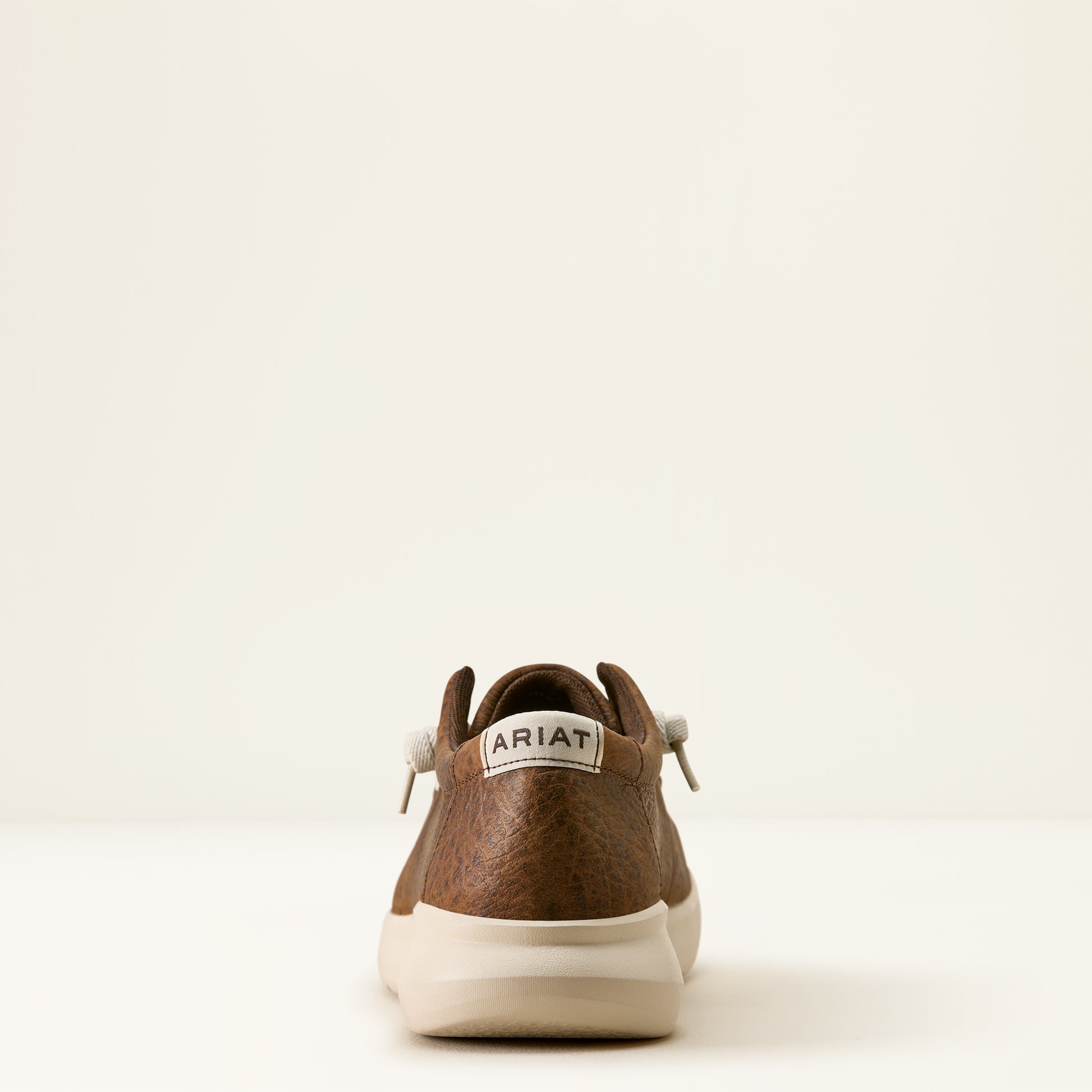the back of a brown shoe by ariat