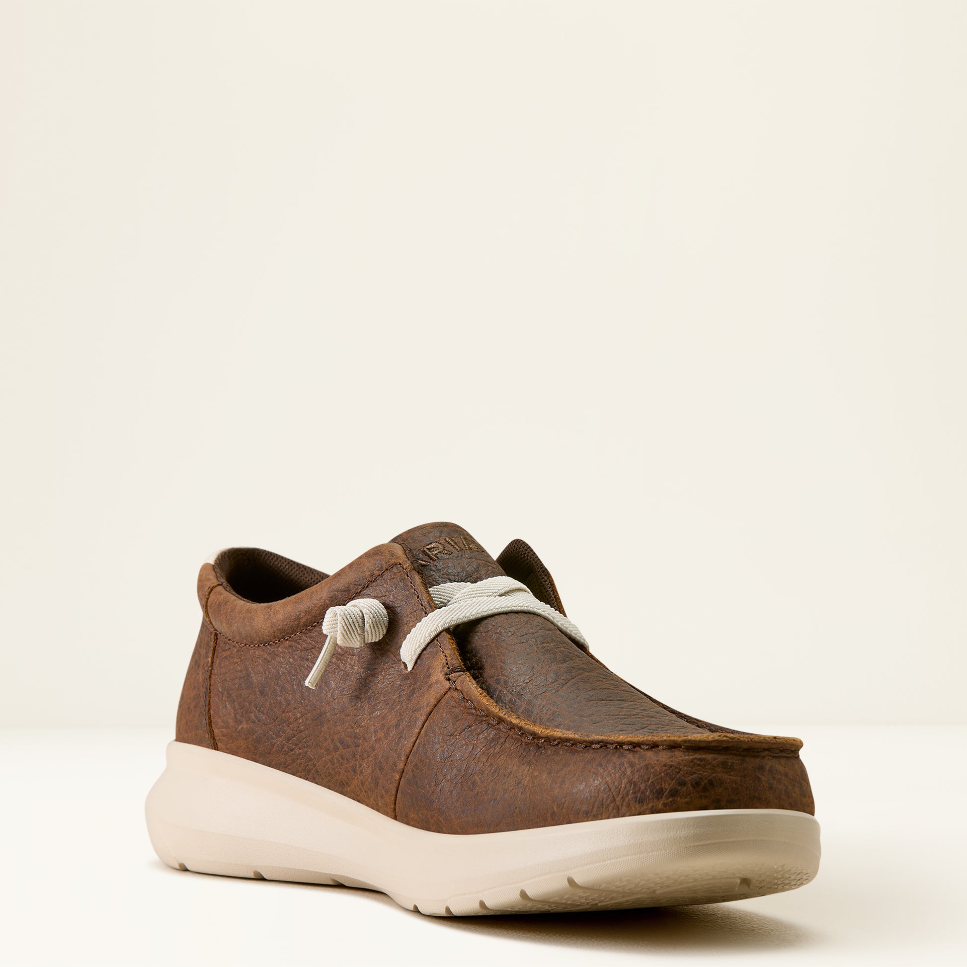 a men's brown elephant print hilo shoe by ariat on an off white background