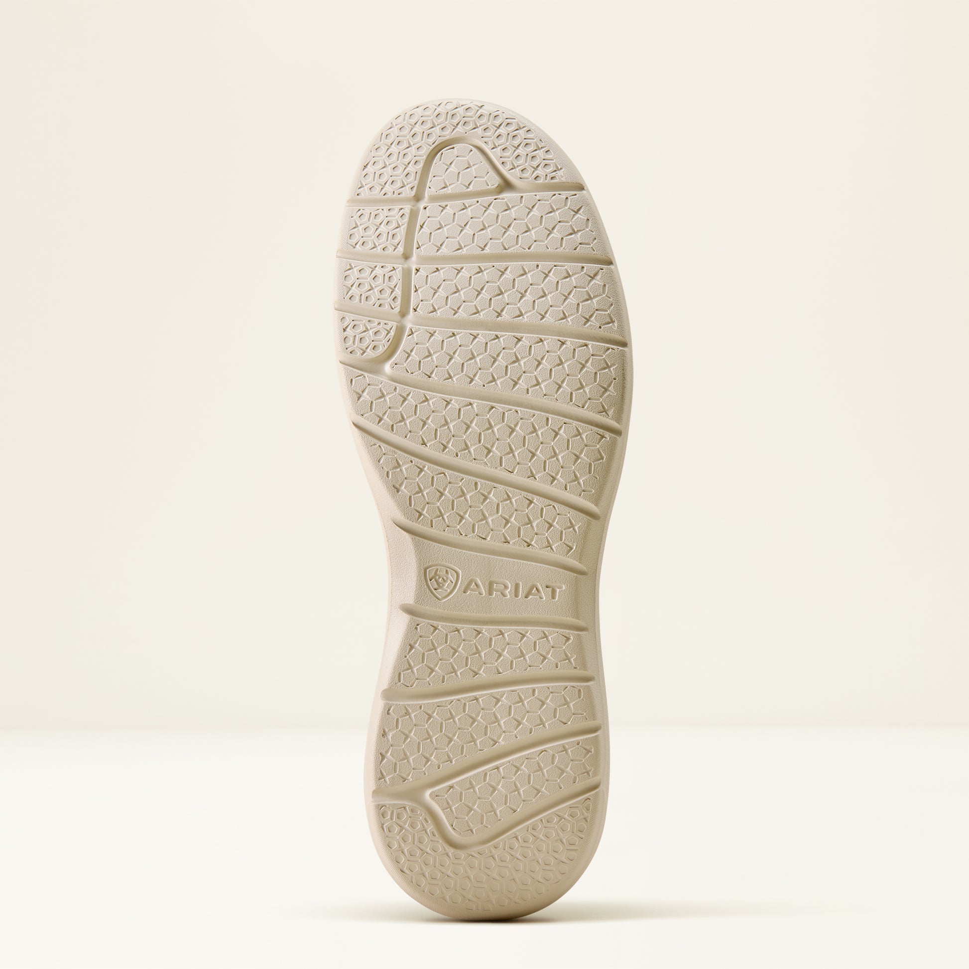 the outsole of a shoe by ariat on an off white background