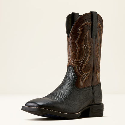 a brown and black wide square toe ariat boot on a cream background